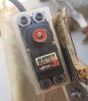 Hitec servo actuator in drone debris