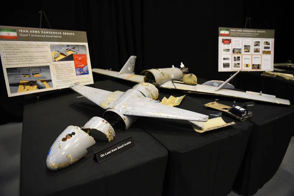Wreckage of a Qasef-1 drone with display boards