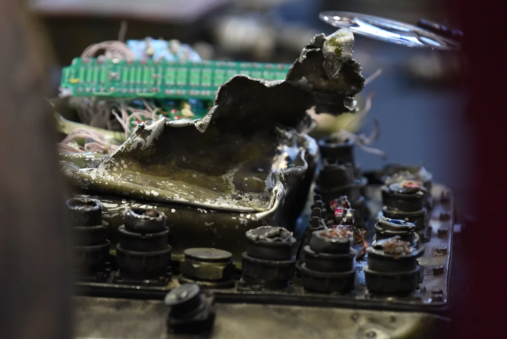 Burnt junction box with circuit board and connectors from a ballistic missile