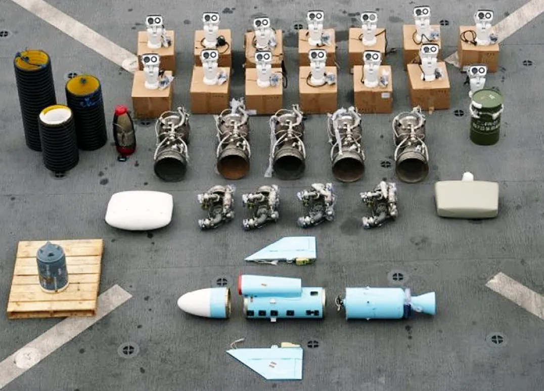 Weapon parts seized from a dhow off Somalia on 11 January 2024 and laid out on deck: missile engines, nose cones, fins and air intakes.